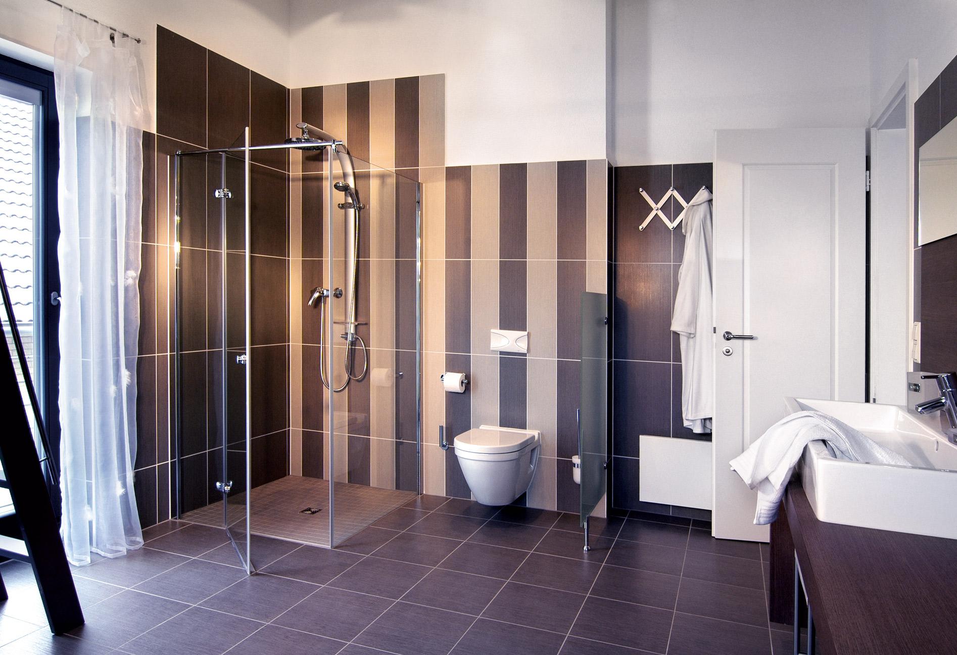 Large bathroom with dark tiles