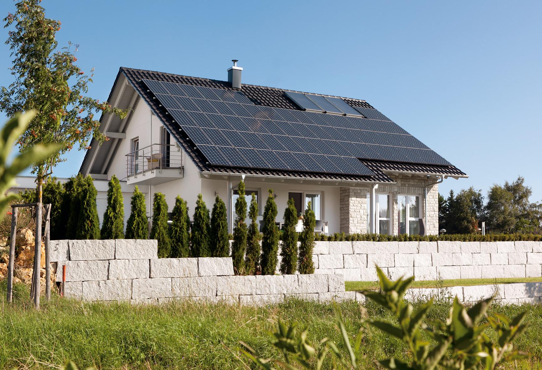 Plus energy house with in-roof photovoltaic system